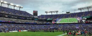 People gathering on the field of M & T Bank Stadium, home of the Baltimore Ravens.