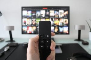 Remote control in front of a TV