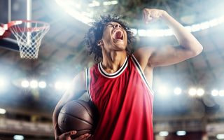 An image of basketball player celebrating a score