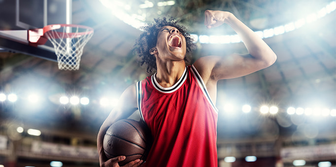 An image of basketball player celebrating a score