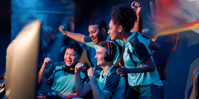 An image of an esports team celebrating a win 